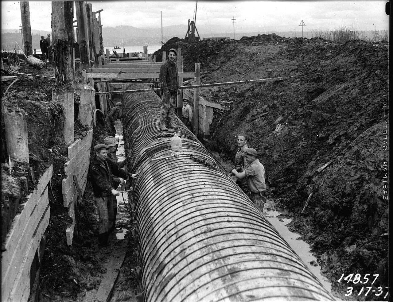 Workers installing Henderson Street trunk sewer, Seattle, Washington, U.S., 1937. "Arcorace and Coluccio et al" according to the master record.